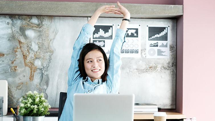 Office Woman Stretching Body For Relaxing While Working With Laptop Computer At Her Desk, Office Lifestyle, Business Situation