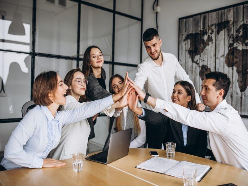 Group Of People Working Out Business Plan In An Office
